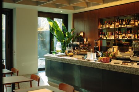derwent london lounges interiors with orange tones, warm colours and soft fabrics
